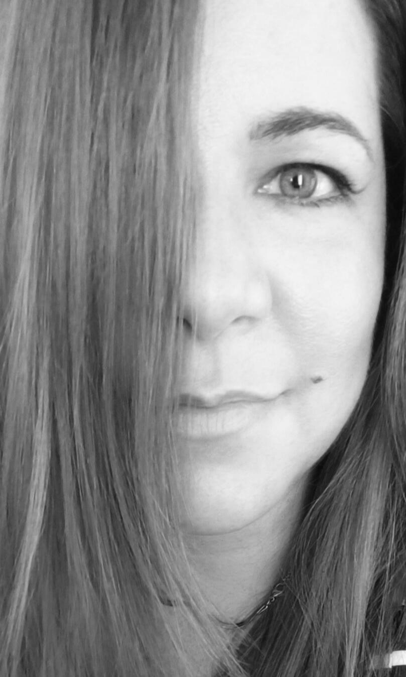 Greyscale photograph of romantasy author, Jocasta King, who wrote the upcoming greek mythology inspired romantasy, EREBOS.